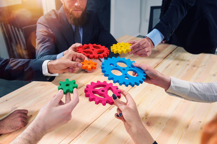 business-team-connect-pieces-gears-like-teamwork-partners_207634-6463